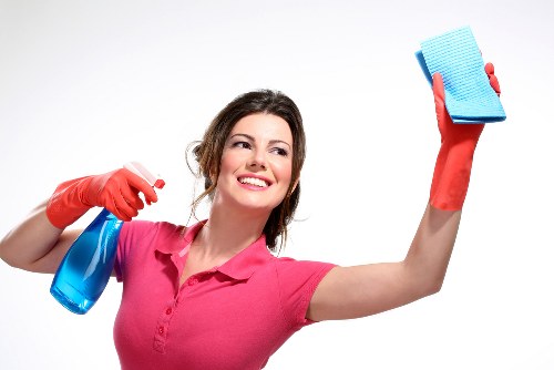 Professional cleaner following safe procedures during routine work